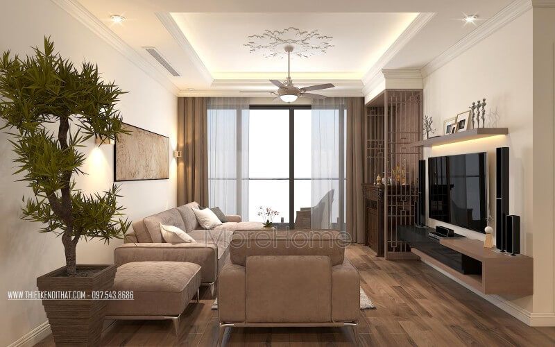 Phòng khách căn hộ thiết kế với bộ sofa nỉ chữ L màu xám được đặt ở không gian phòng khách rộng lớn là điểm nhấn ấn tượng tăng thêm sự đẳng cấp cho không gian