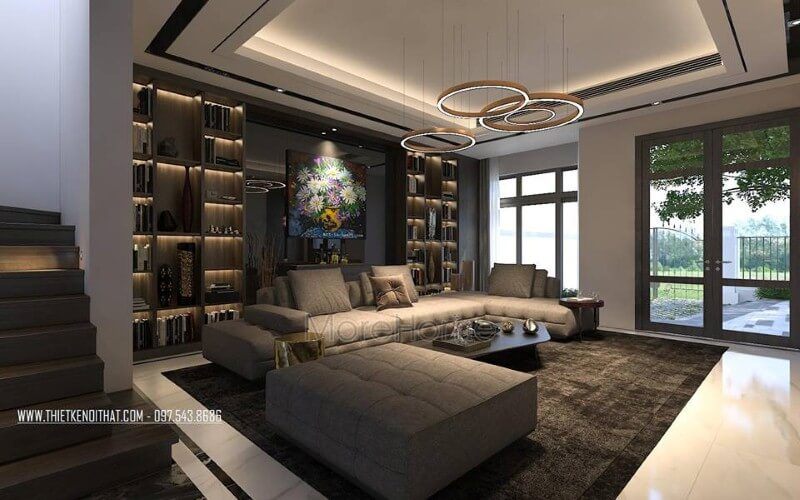 Trang trí nội thất phòng khách biệt thự, nhà phố sử dụng sắc trầm chủ đạo nhưng vẫn tạo nên không gian thông thoáng bởi hệ cửa kính rộng thông thoáng.
